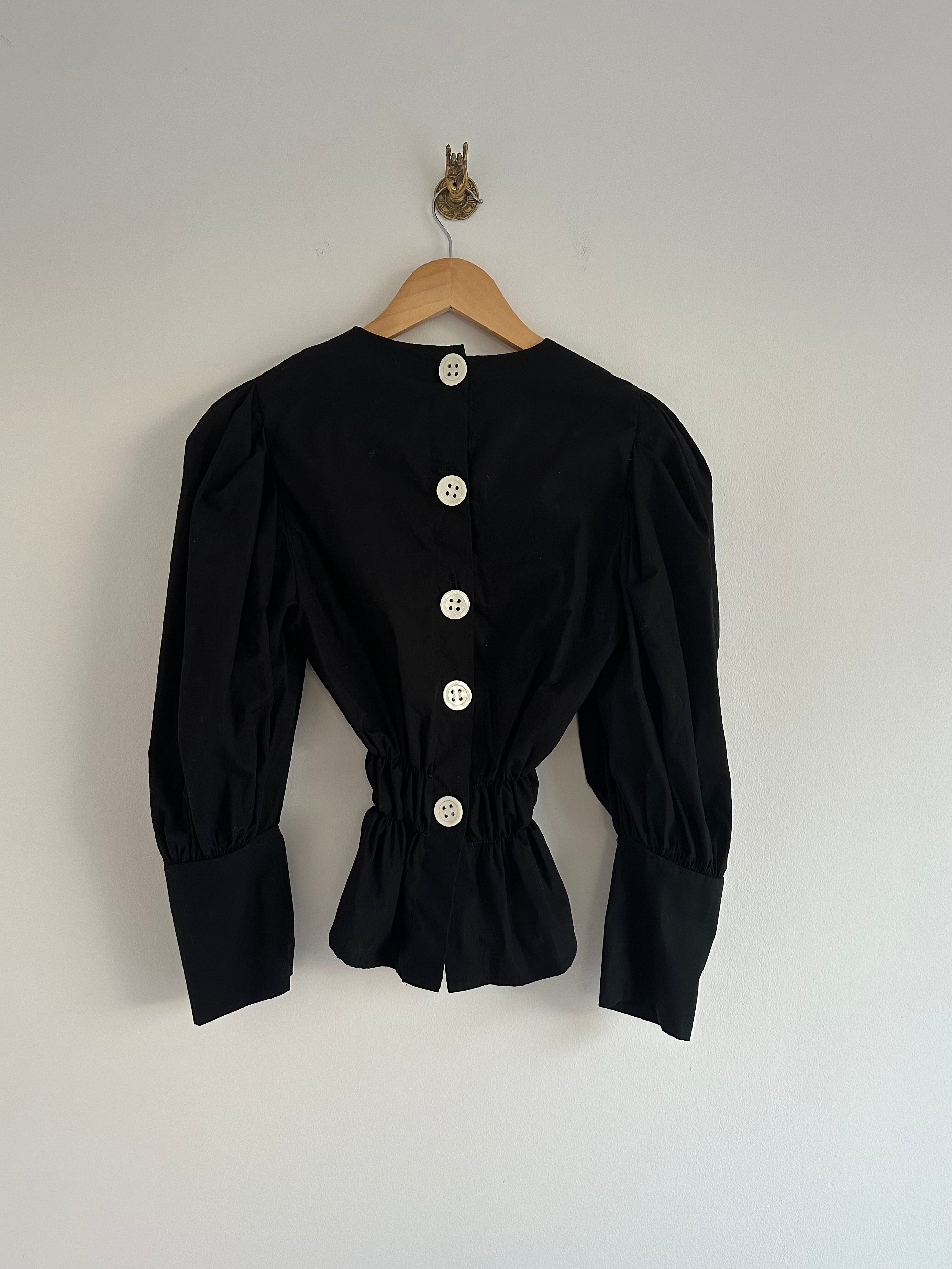 Zwarte blouse elastiek