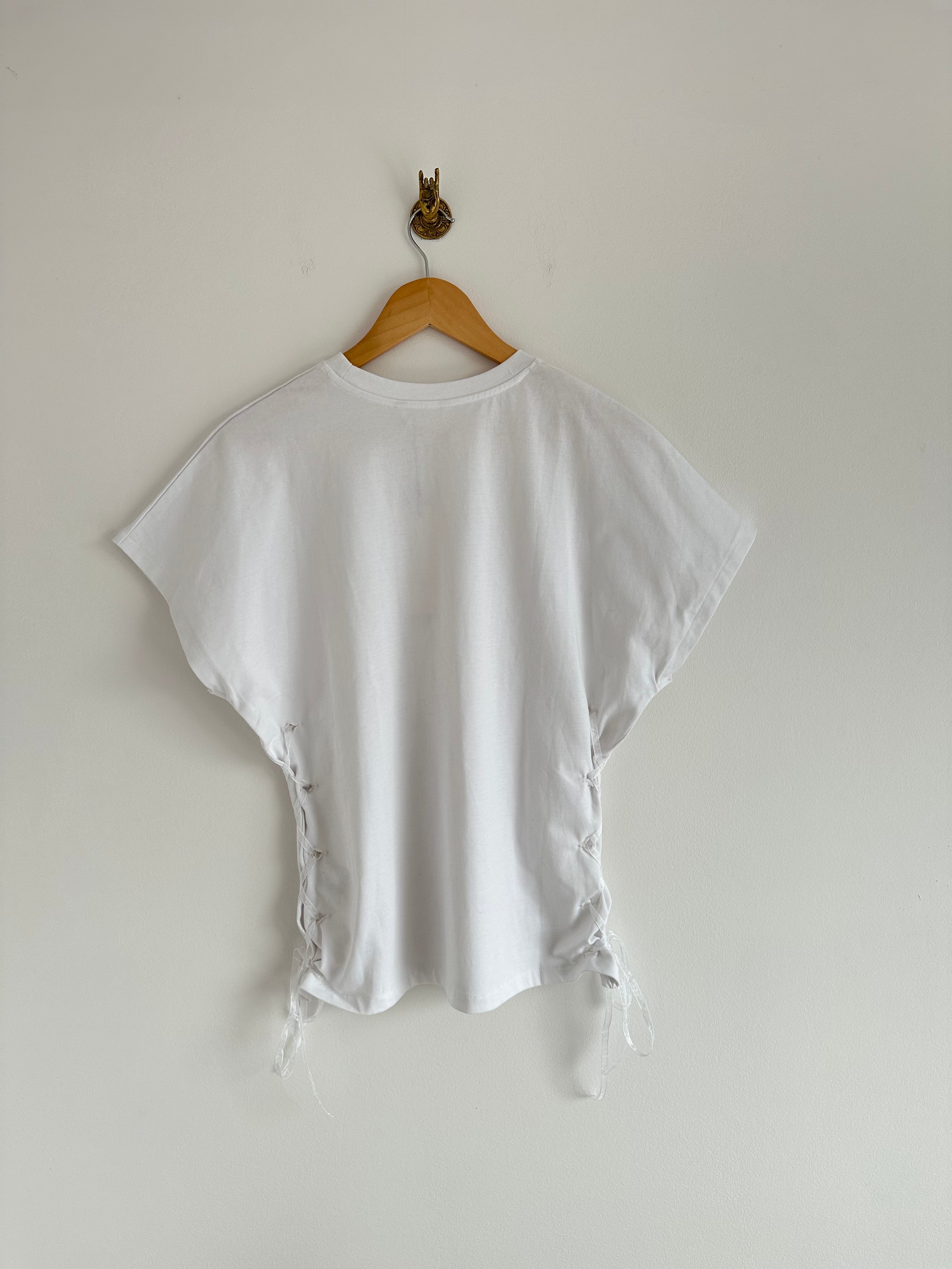Witte top met knoopsgaten
